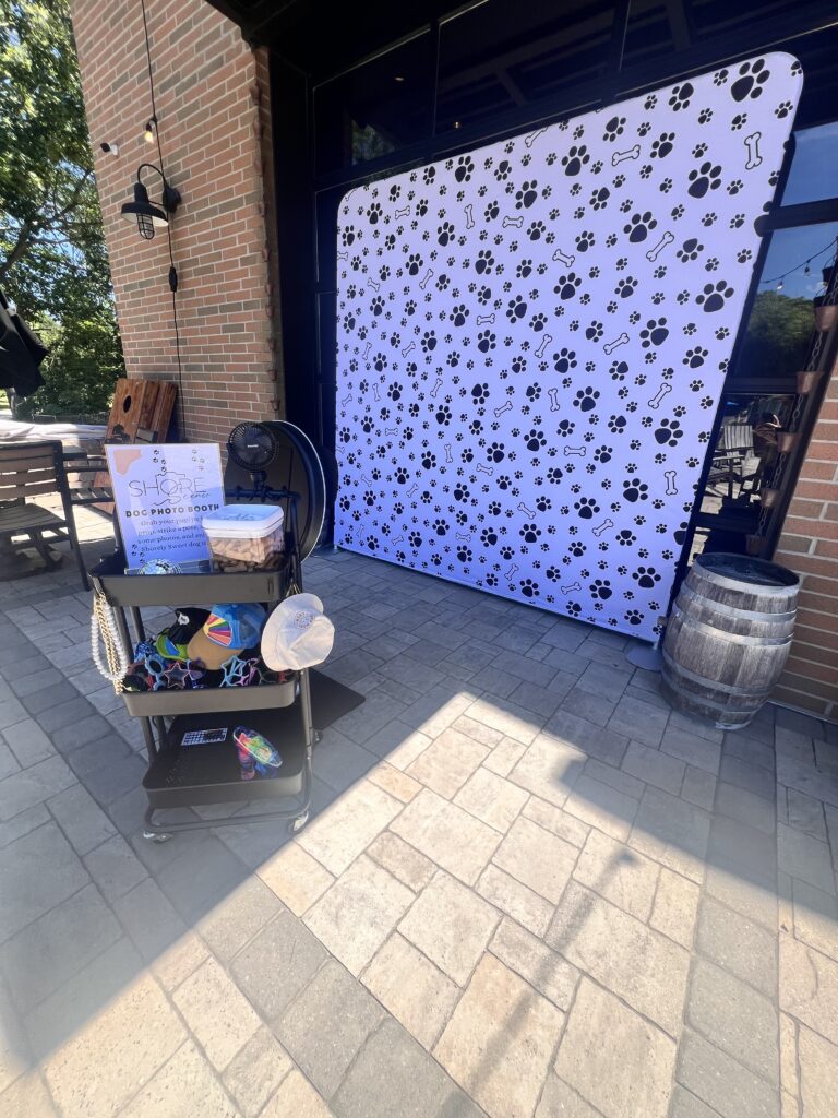 Mini (Doggy) Photo Booth Set Up Featuring the Woof Wonderland Backdrop, Mini Prop Cart and Shorely Sweet Dog Treats